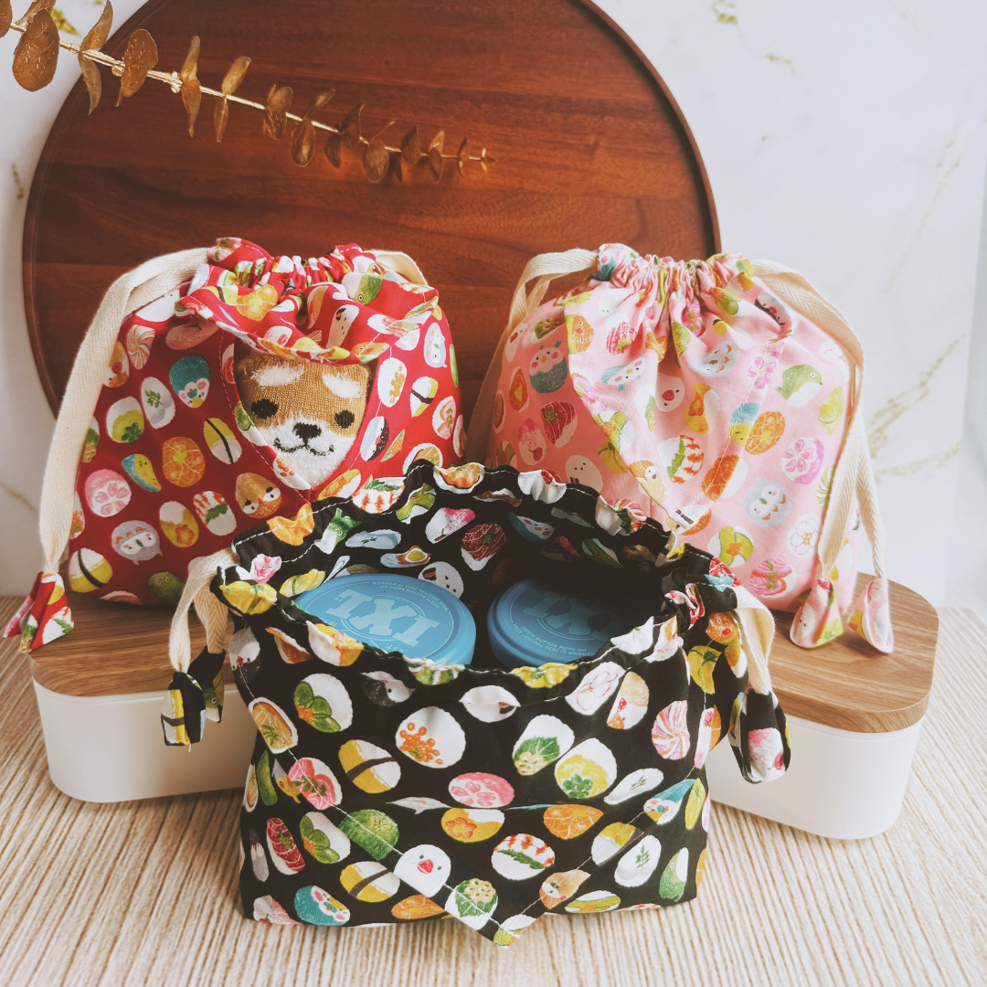 Bundle Pouches in Red, Pink and Black, showing items inside