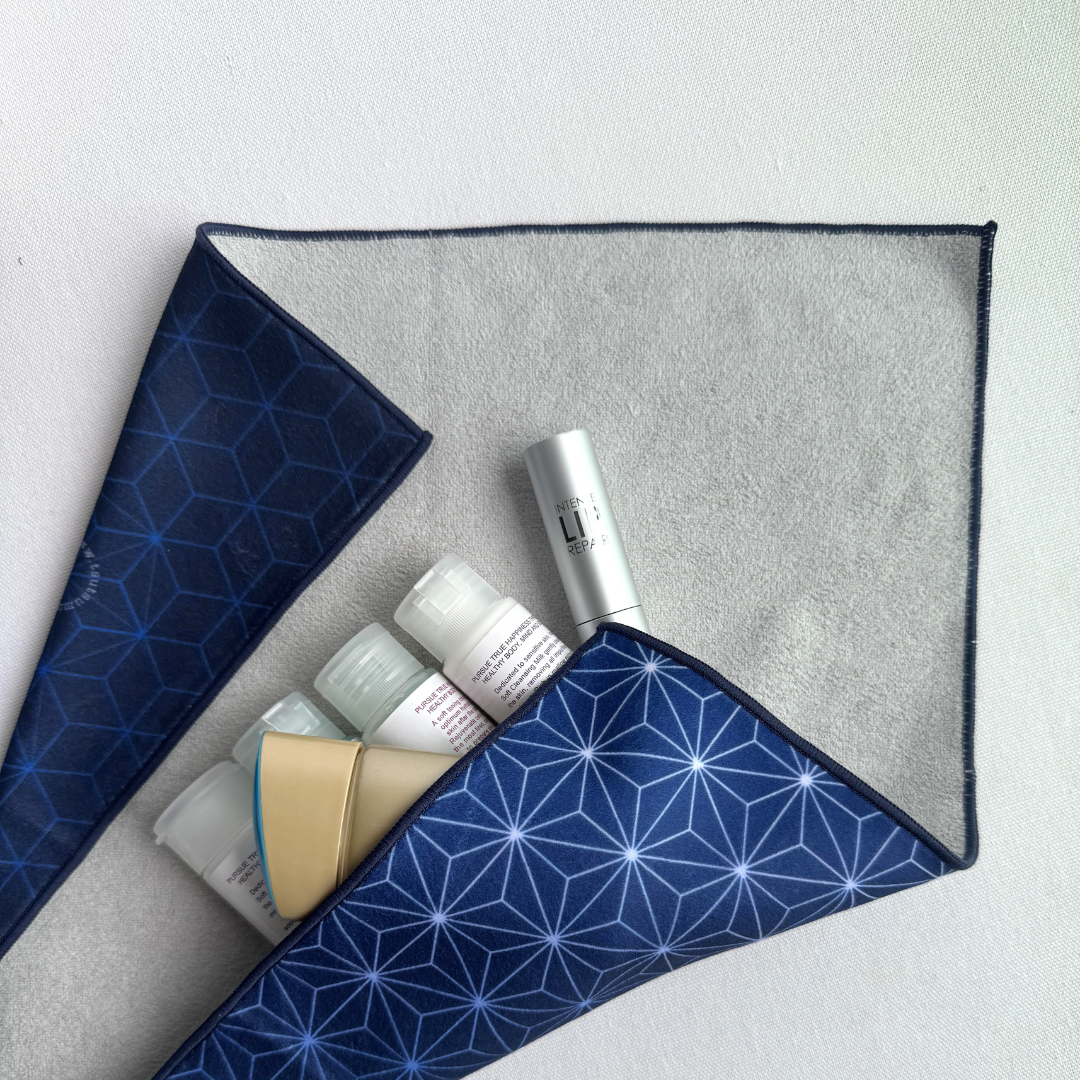Blue geometric patterned fabric wrap with skincare products