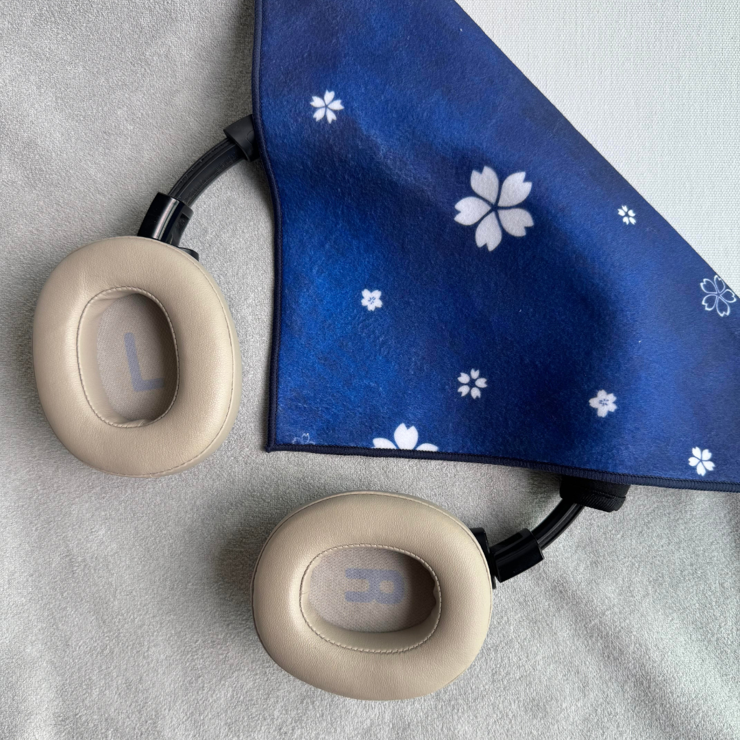 Blue Asanoha geometric patterned fabric partially wrapping earphones
