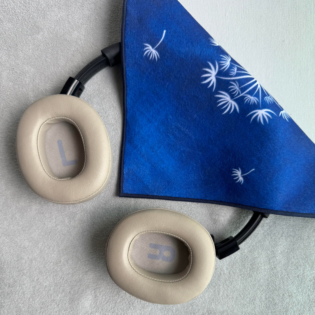 Blue Tanpopo (dandelion) patterned fabric partially wrapping earphones