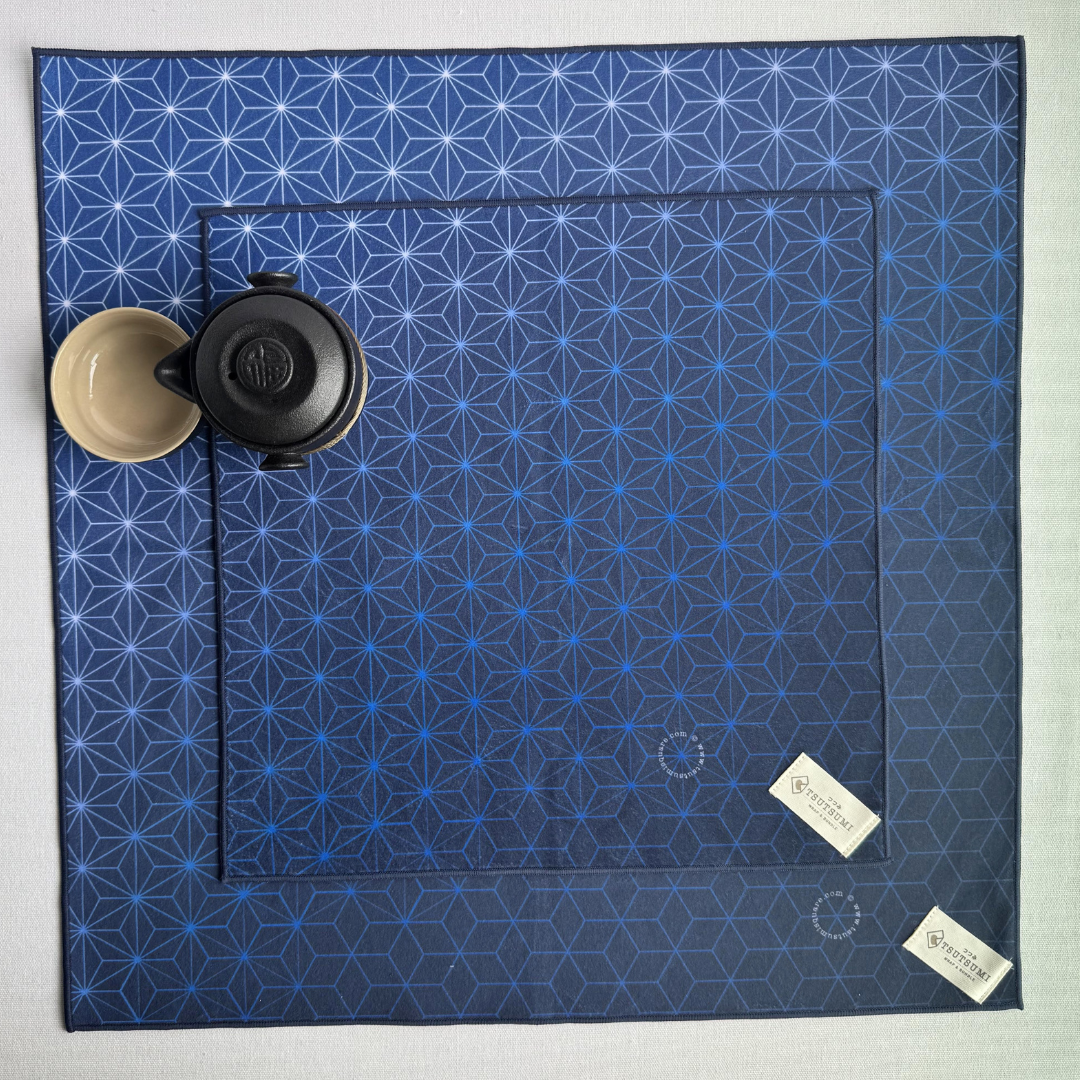 Blue Asanoha geometric patterned fabric wraps of 2 different sizes on a white background