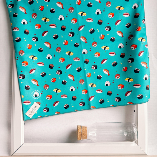 Blue fabric with sushi print draping over a picture frame