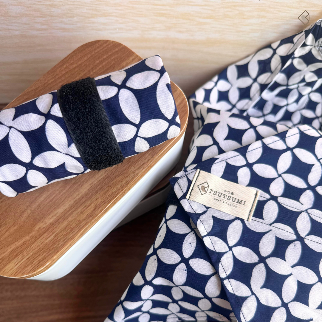 Navy and white patterned fabric wraps with visible 'Tsutsumi' brand label