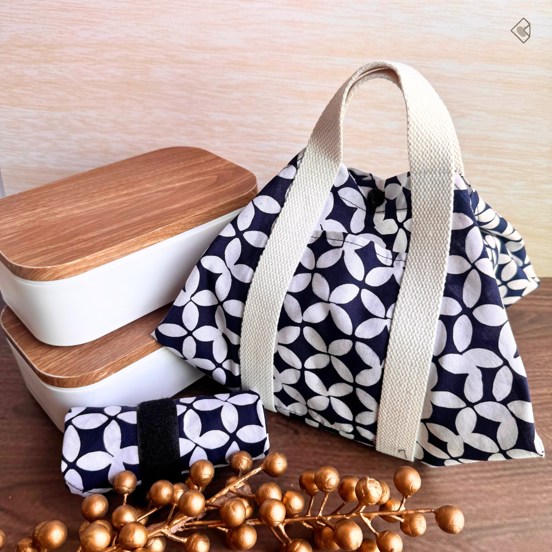 Navy and white patterned bag with wooden containers on a wooden surface