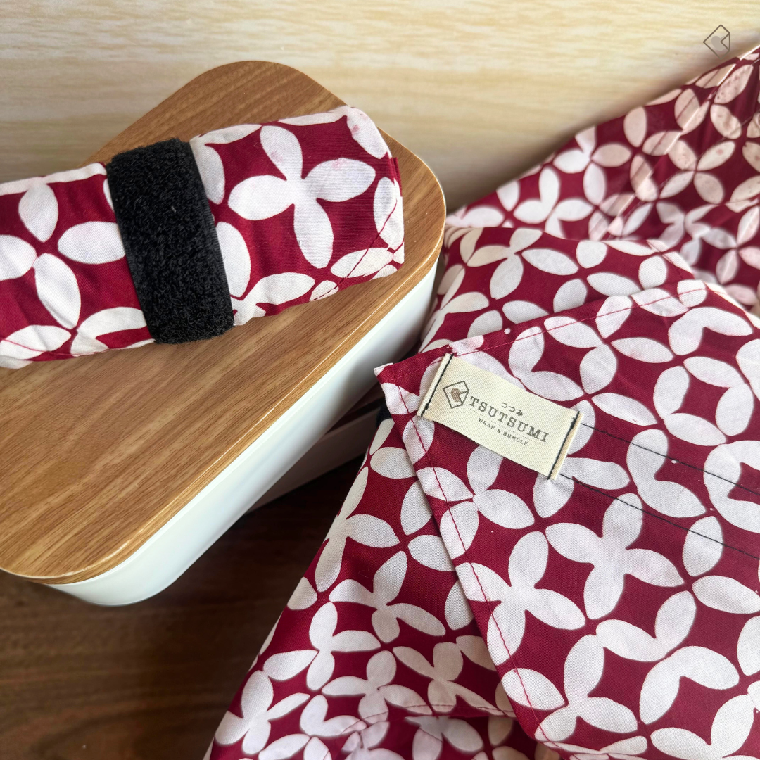 Red and white patterned fabric wraps with visible 'Tsutsumi' brand label