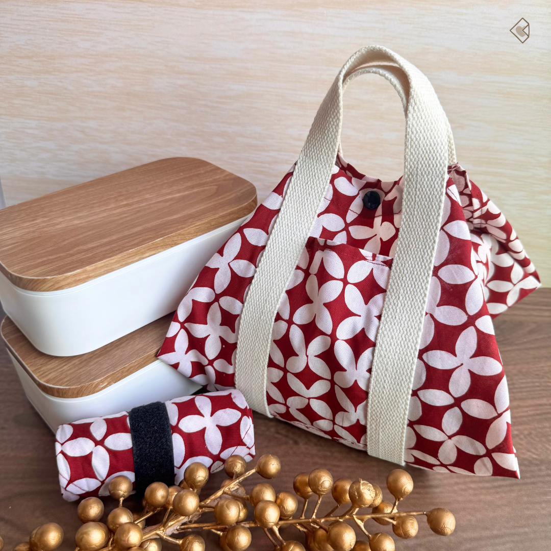 Red and white patterned bag with wooden containers on a wooden surface