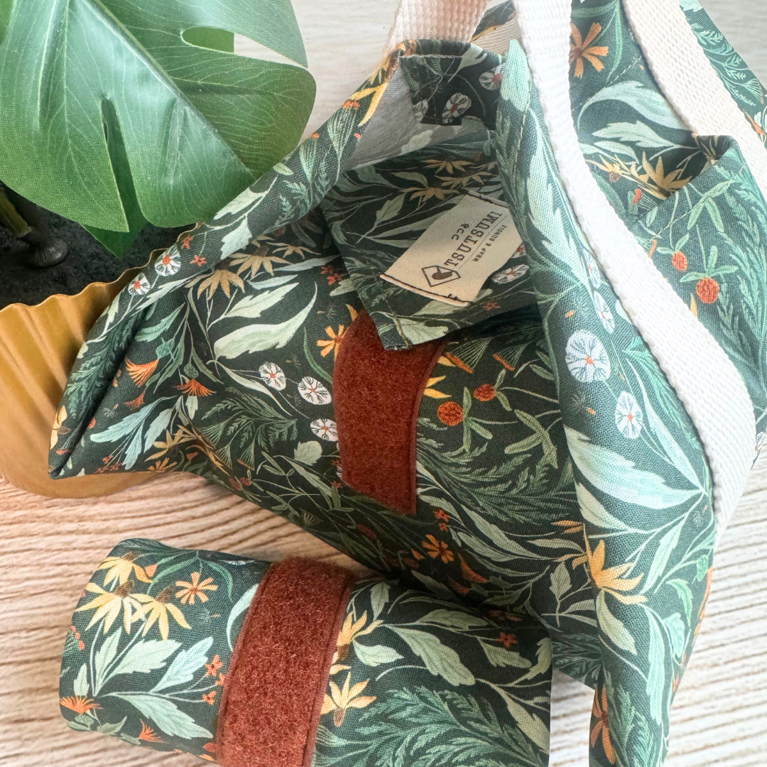 Green floral-patterned square wrap and a rolled up wrap
